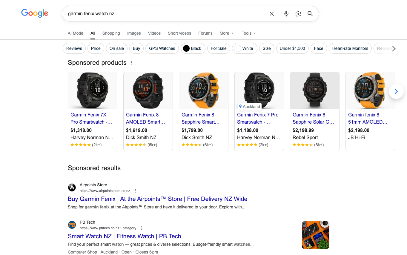 Google Shopping ads appearing for garmin fenix watch nz on desktop showing product images, prices and retailers before any other results